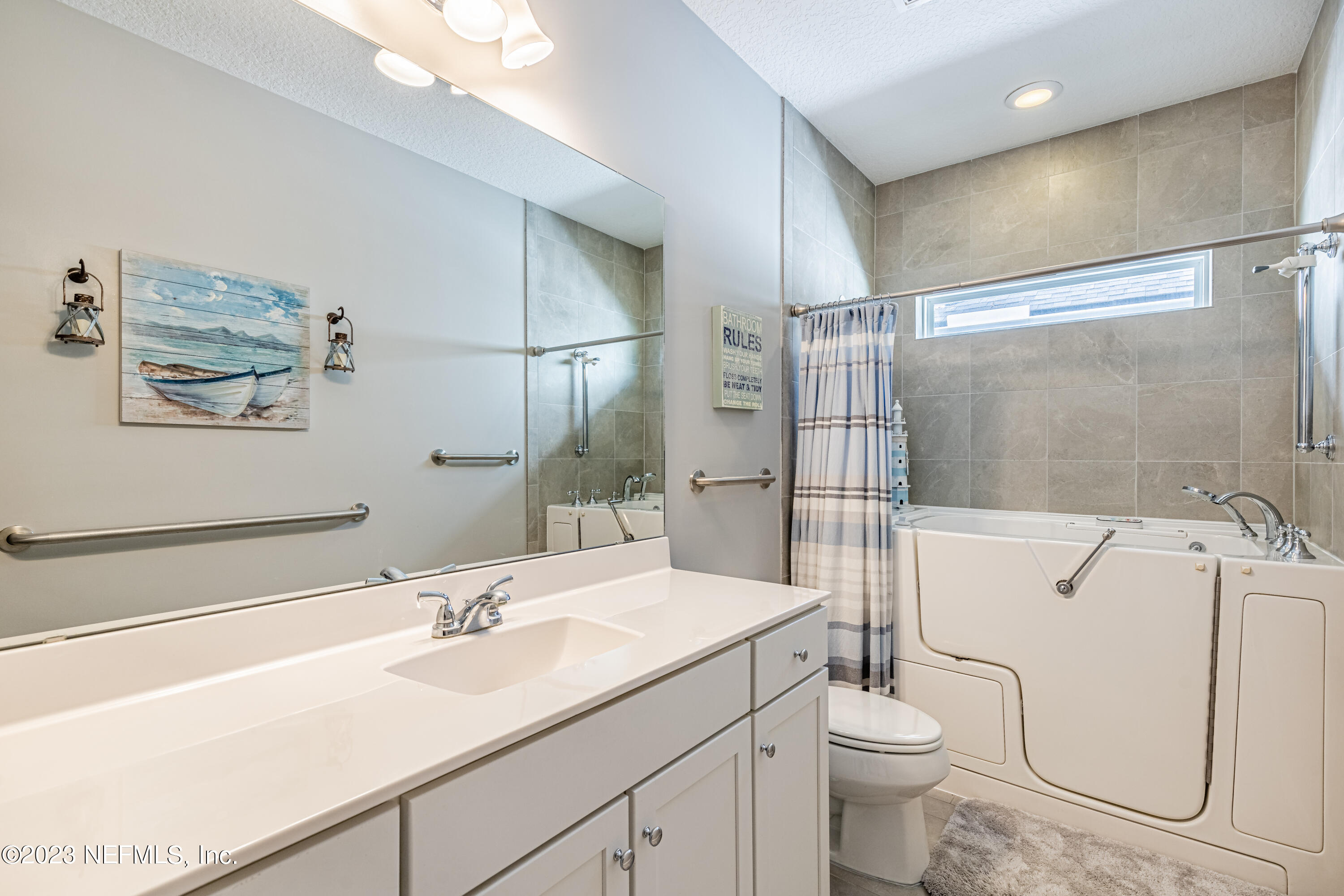 871 Bent Creek Drive St. Johns, FL 32259 - Photo 37 of 71 a bathroom with a sink toilet vanity and shower