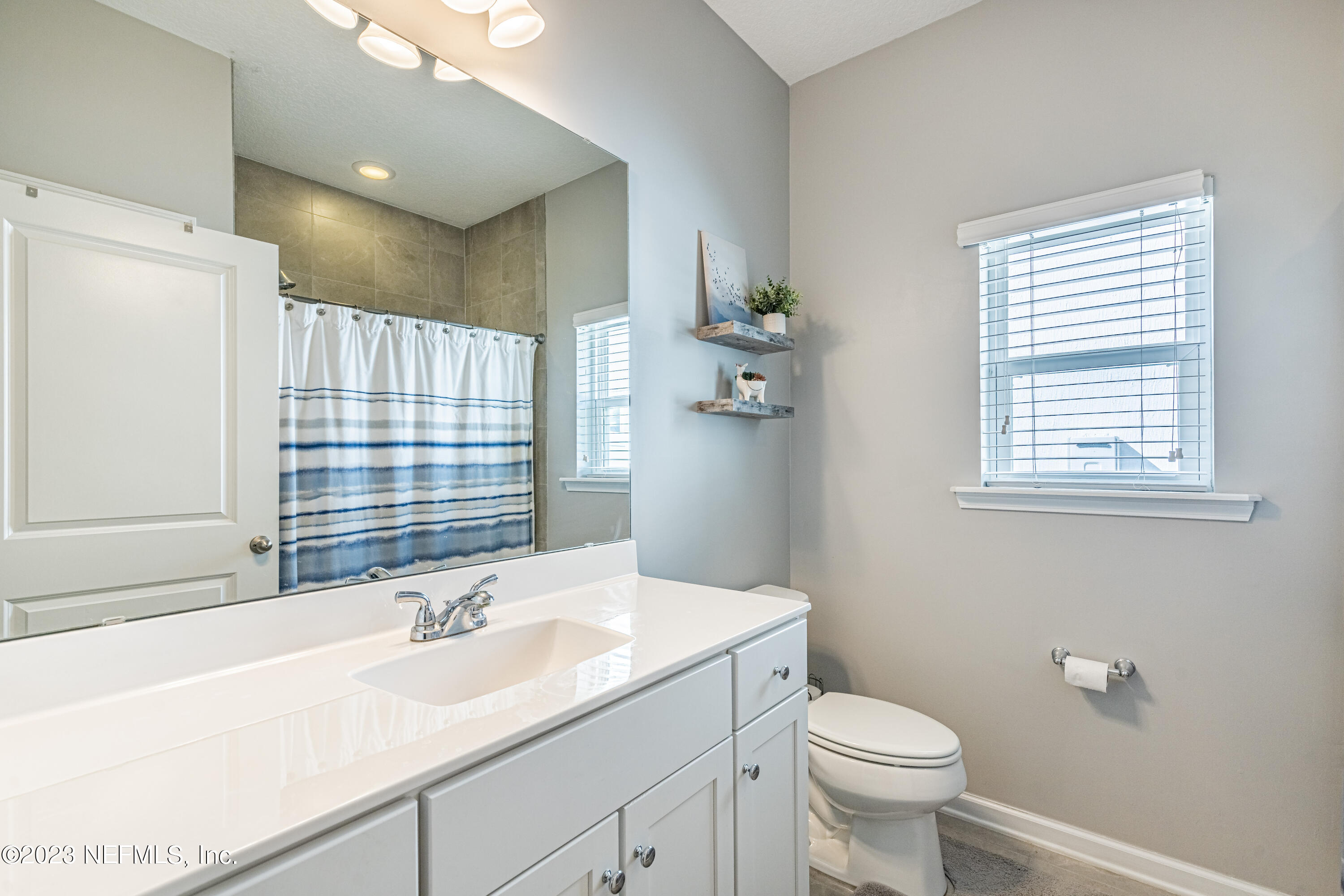 871 Bent Creek Drive St. Johns, FL 32259 - Photo 40 of 71 a bathroom with a sink toilet and shower