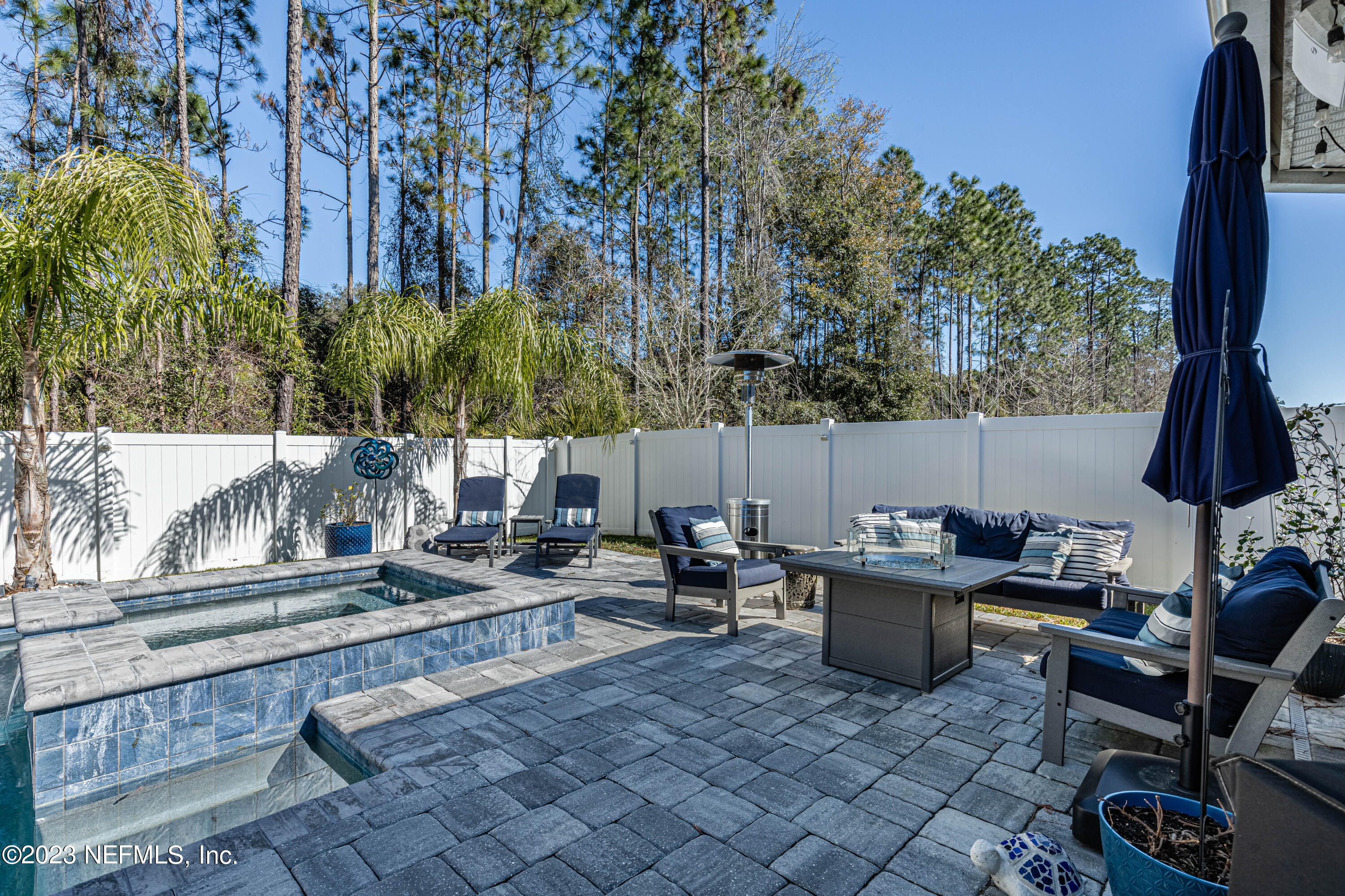 871 Bent Creek Drive St. Johns, FL 32259 - Photo 51 of 71 a backyard of a house with barbeque oven table and chairs