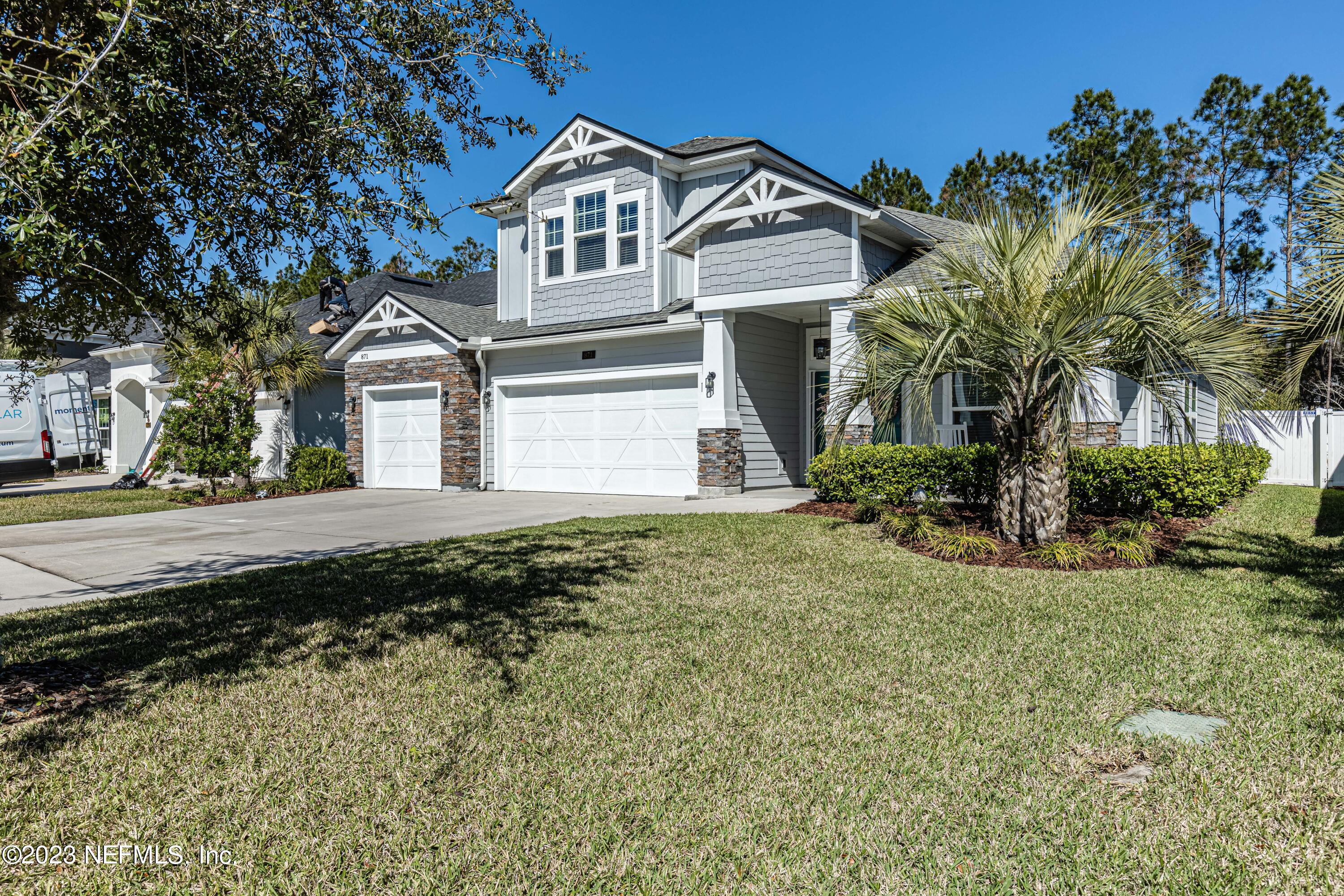 871 Bent Creek Drive St. Johns, FL 32259 - Photo 60 of 71 a front view of a house with a yard