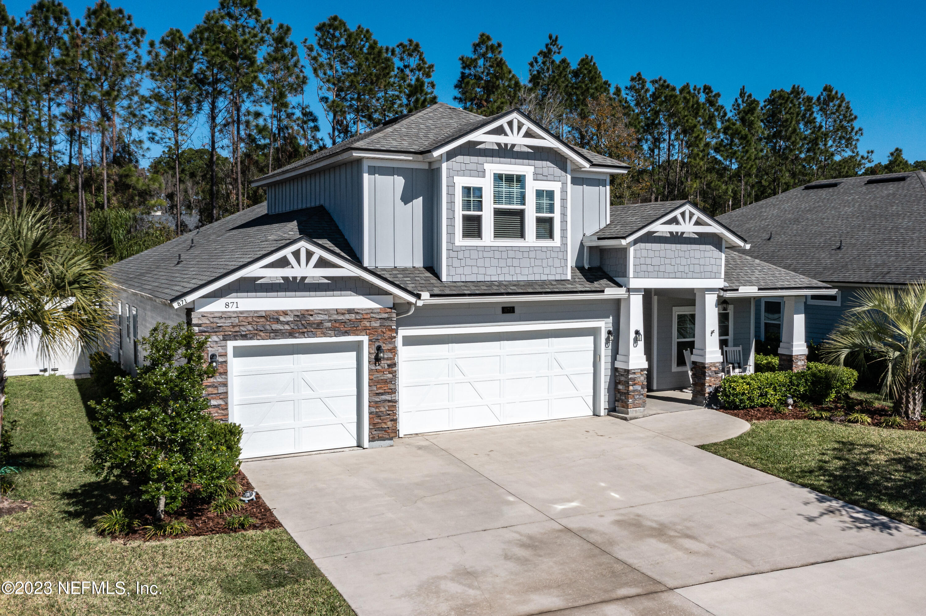 871 Bent Creek Drive St. Johns, FL 32259 - Photo 63 of 71 a front view of a house with a yard and garage