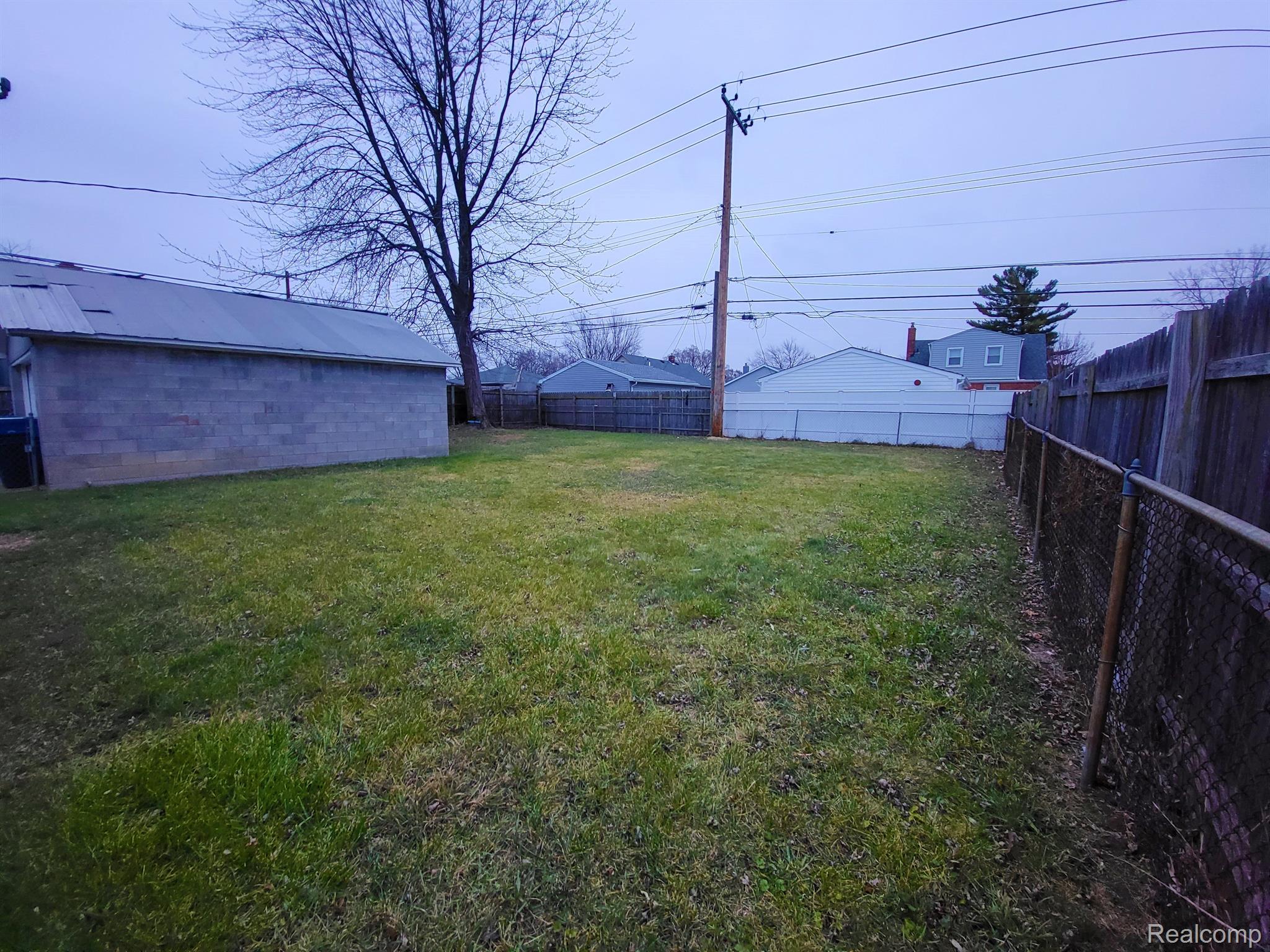 8308 Stephens Road Warren, MI 48089 - Photo 22 of 27 Showing the side of the yard plus its fully fenced