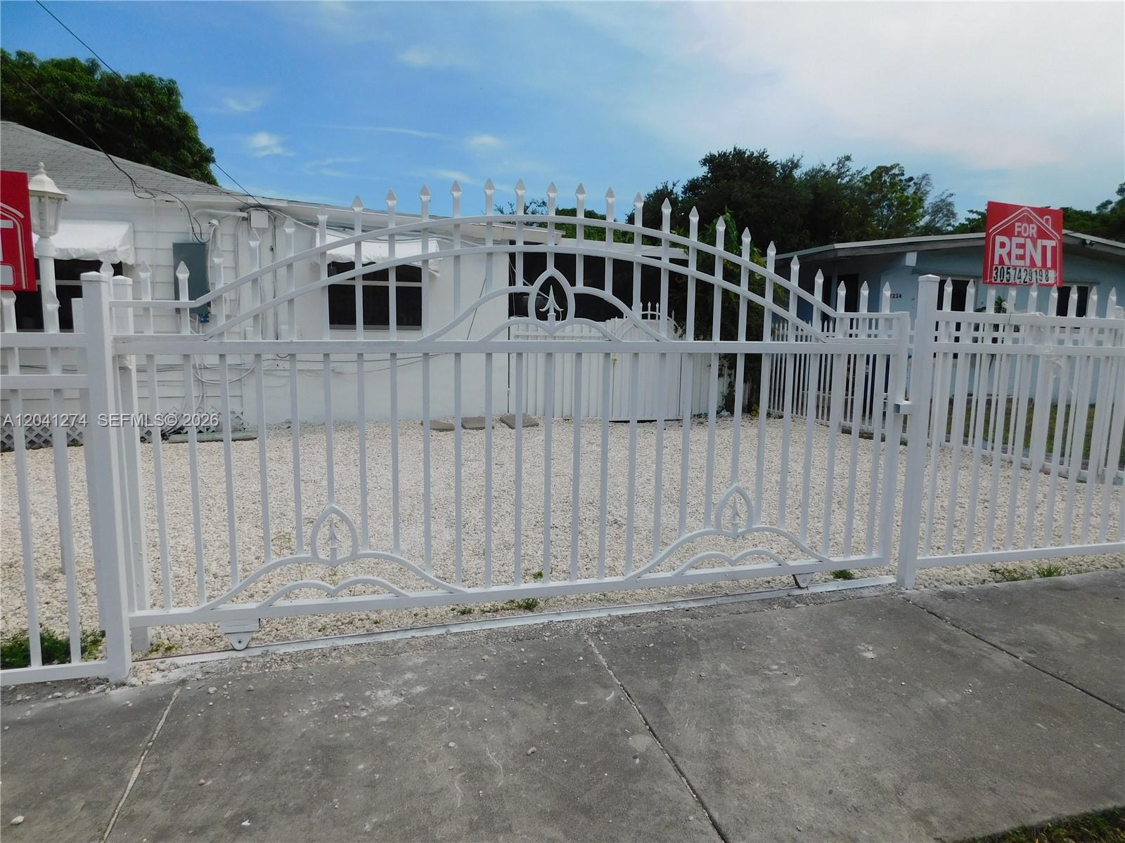 a view of a house with a small yard