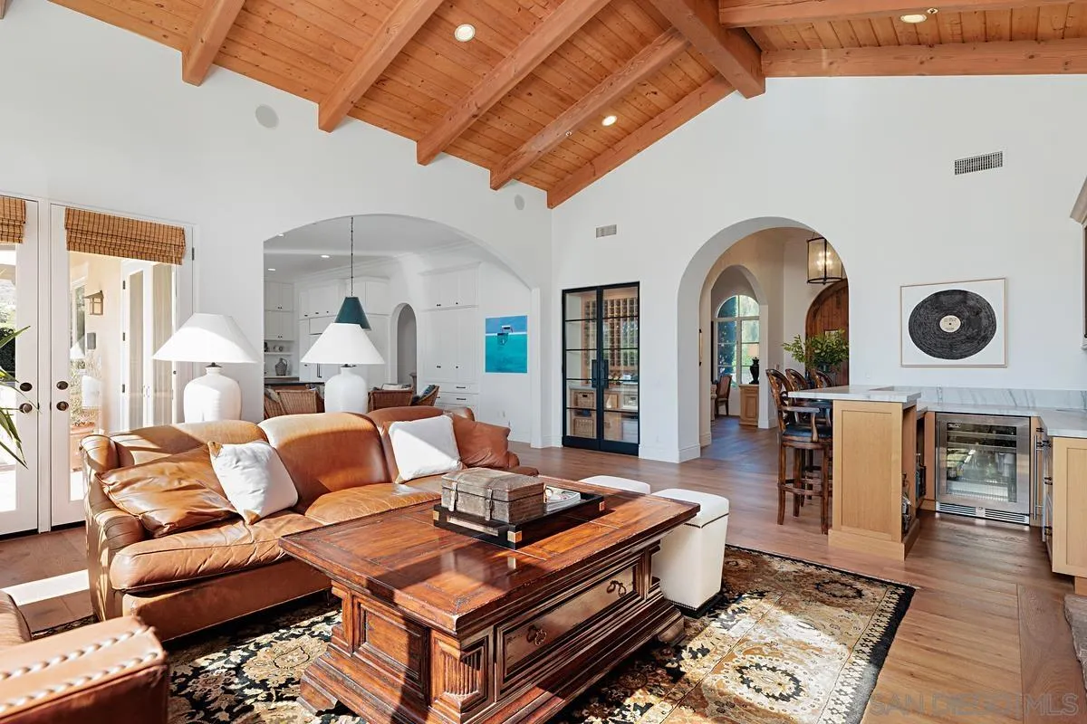 13657 Paseo De La Huerta Poway, CA 92064 - Photo 13 of 38 a living room with furniture and wooden floor
