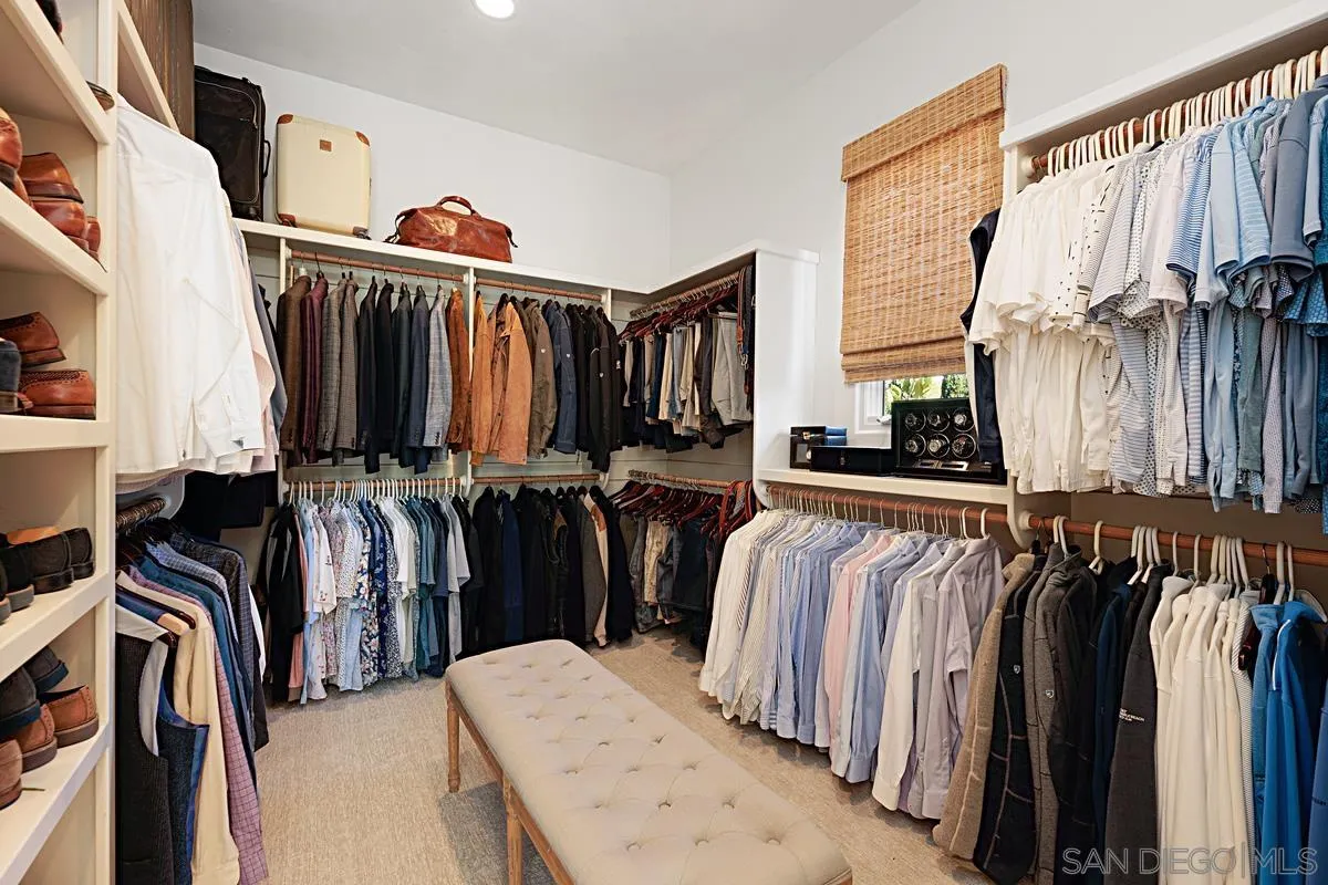 13657 Paseo De La Huerta Poway, CA 92064 - Photo 18 of 38 a view of walk in closet with clothes and shoes