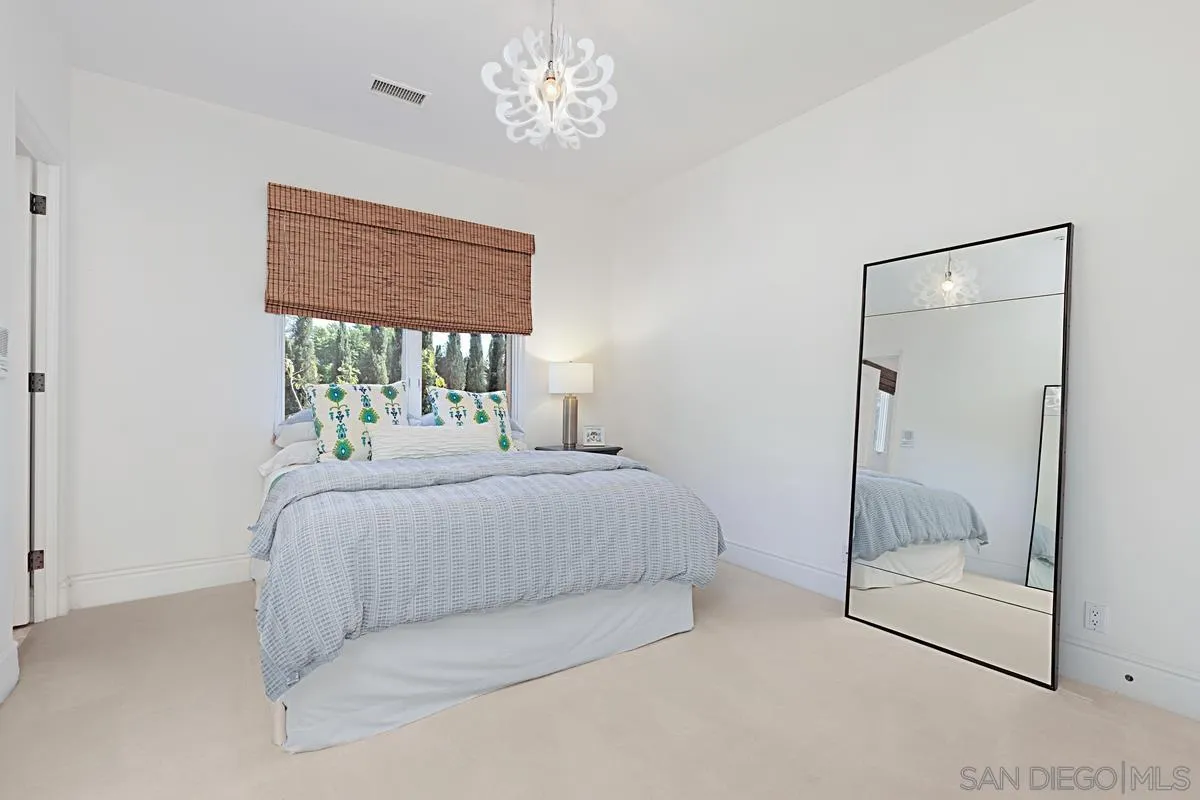 13657 Paseo De La Huerta Poway, CA 92064 - Photo 20 of 38 a bedroom with a bed and a window