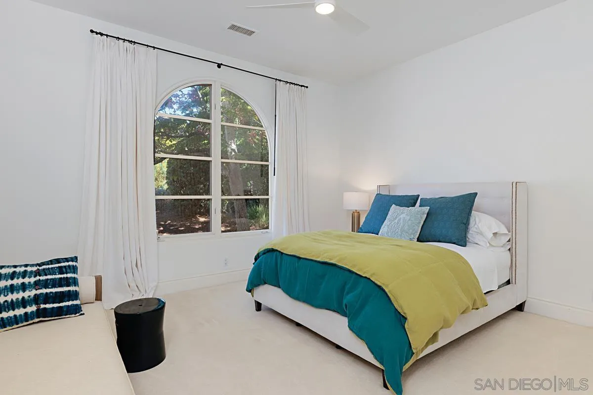 13657 Paseo De La Huerta Poway, CA 92064 - Photo 22 of 38 a bedroom with a bed and a window