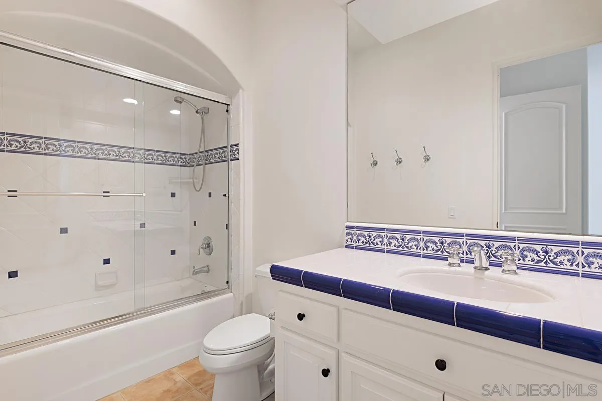 13657 Paseo De La Huerta Poway, CA 92064 - Photo 23 of 38 a bathroom with a bathtub and a toilet
