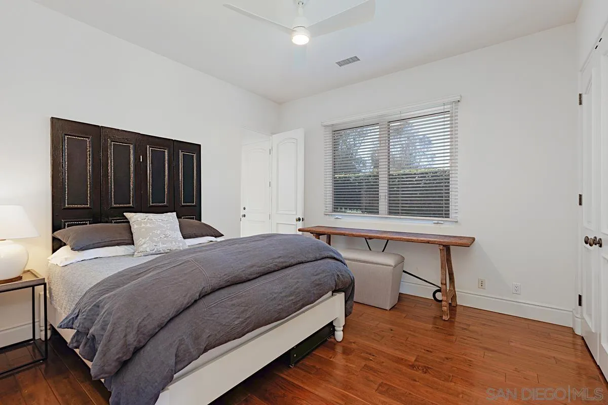 13657 Paseo De La Huerta Poway, CA 92064 - Photo 24 of 38 a bedroom with a bed and a window