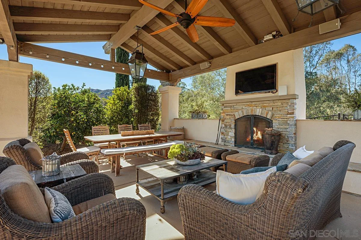 13657 Paseo De La Huerta Poway, CA 92064 - Photo 27 of 38 a living room with furniture and a fireplace