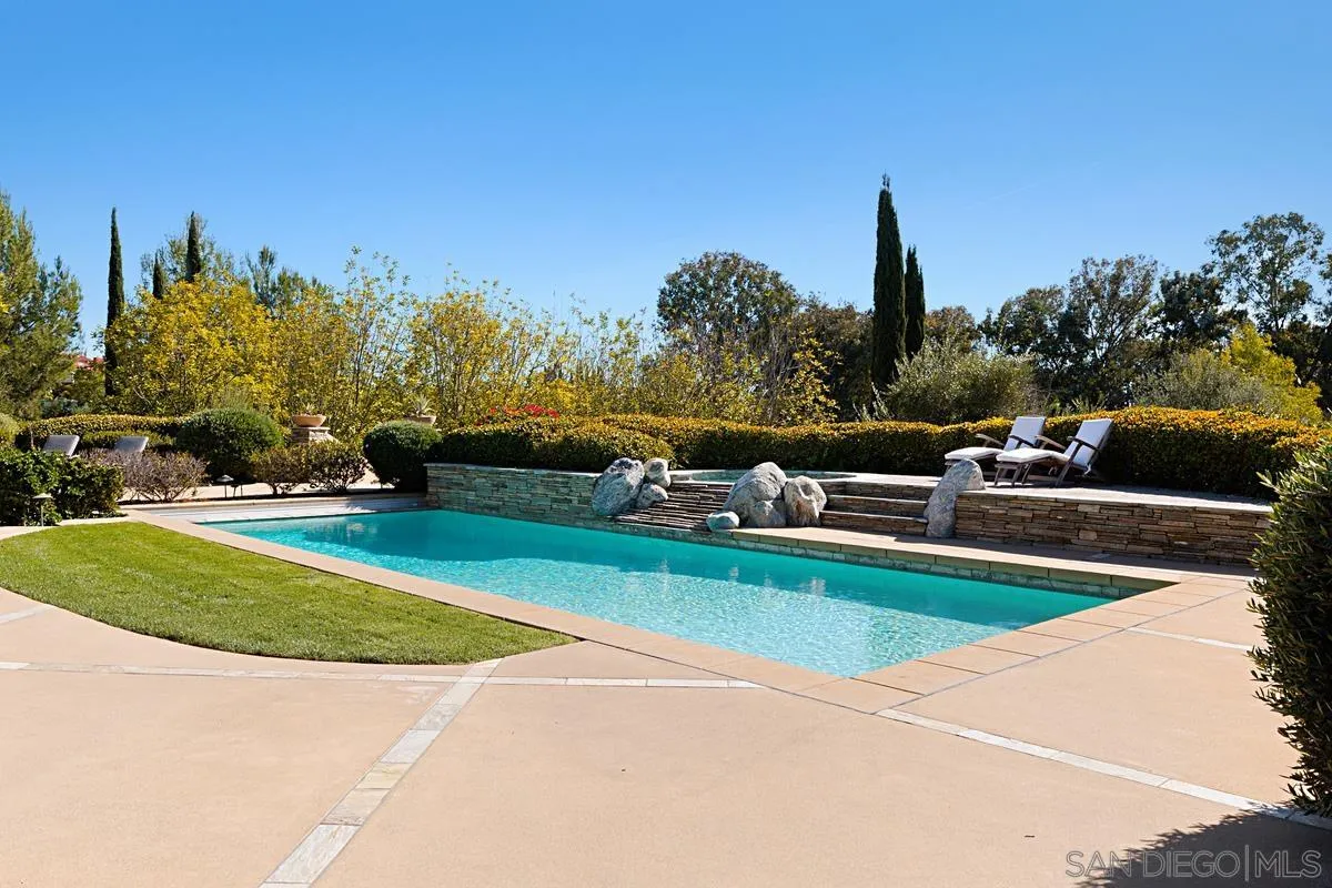 13657 Paseo De La Huerta Poway, CA 92064 - Photo 29 of 38 a view of a swimming pool and lounge chairs