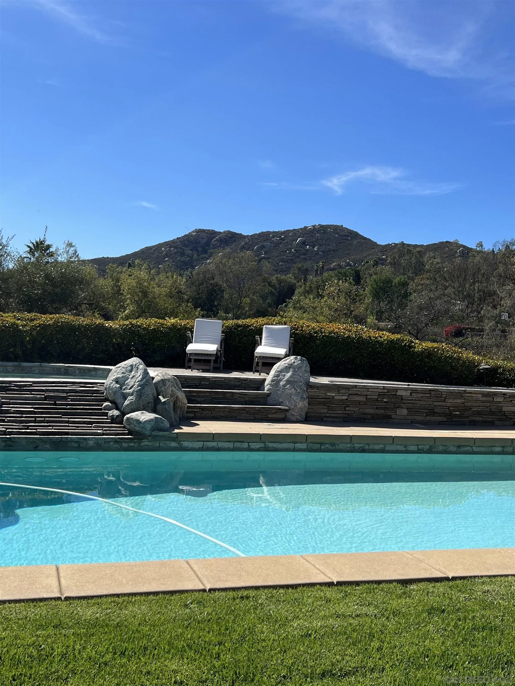 13657 Paseo De La Huerta Poway, CA 92064 - Photo 38 of 38 a view of a lake with a mountain in the background
