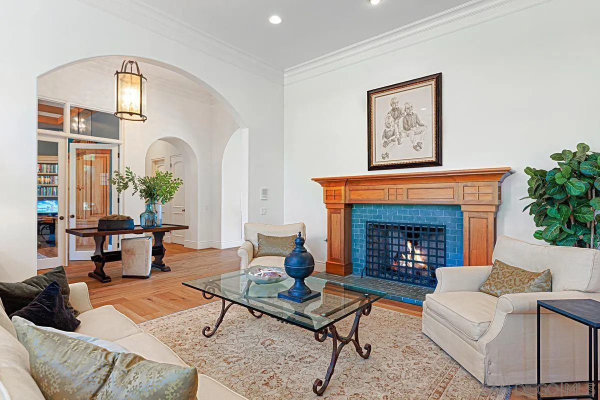 13657 Paseo De La Huerta Poway, CA 92064 - Photo 5 of 38 a living room with furniture fireplace and potted plant