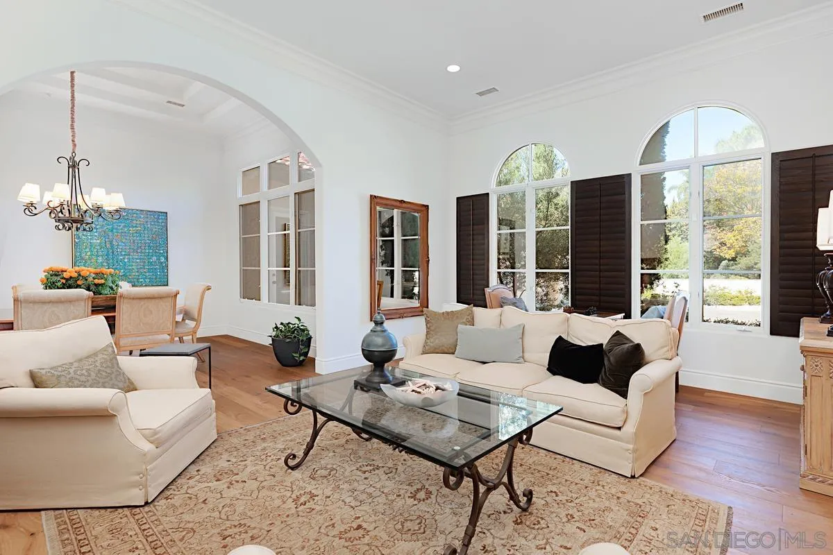 13657 Paseo De La Huerta Poway, CA 92064 - Photo 6 of 38 a living room with furniture potted plant and a large window