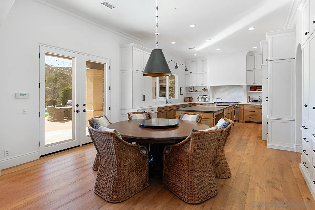 13657 Paseo De La Huerta Poway, CA 92064 - Photo 8 of 38 a dining room with furniture and wooden floor