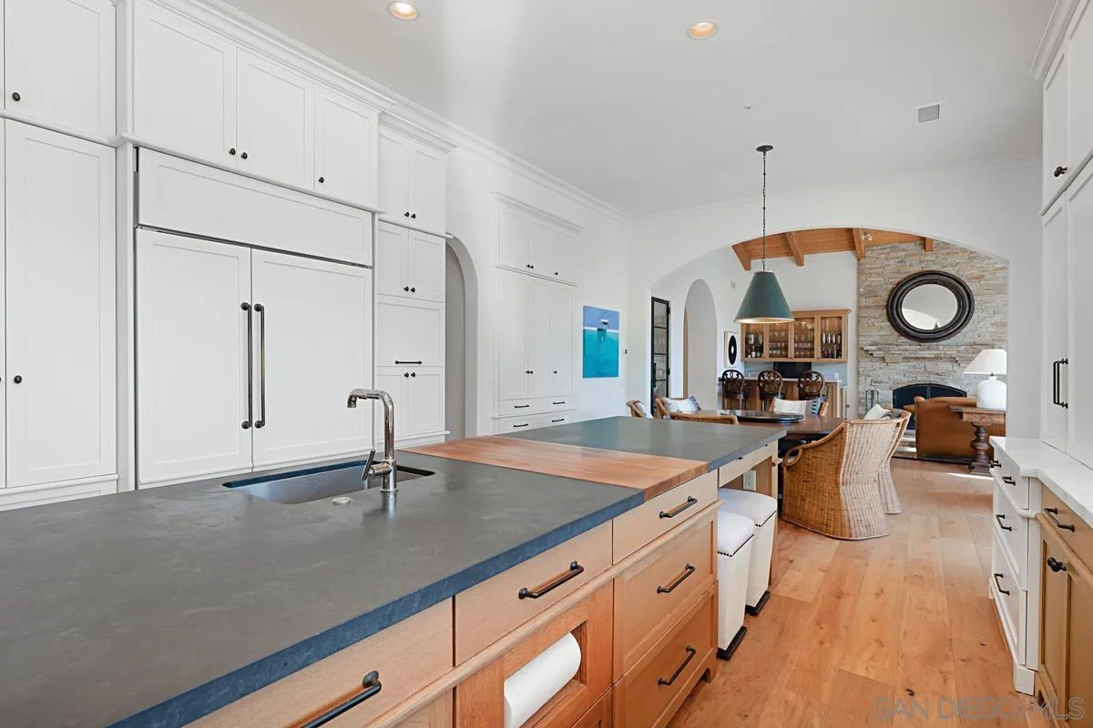 13657 Paseo De La Huerta Poway, CA 92064 - Photo 10 of 38 a kitchen with stainless steel appliances granite countertop a sink a stove and a refrigerator