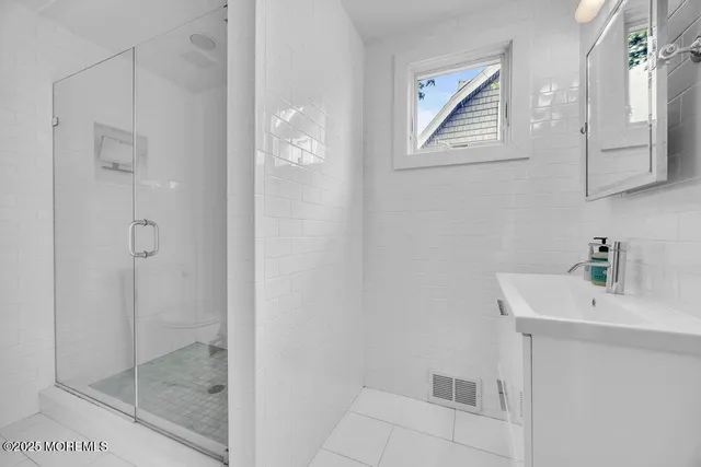 a bathroom with a bathtub and a sink