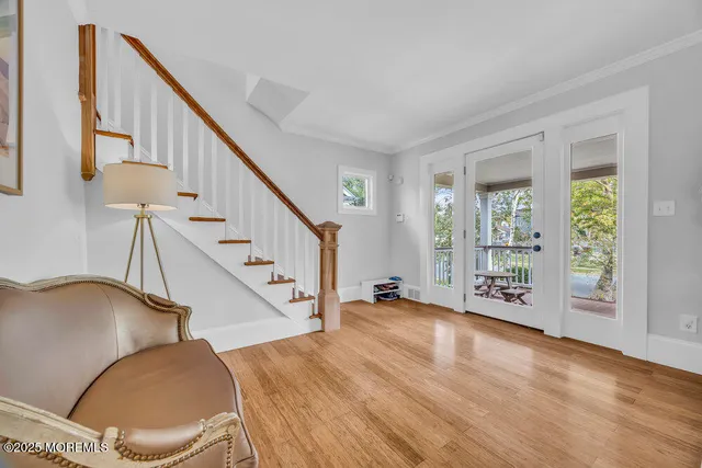 a view of an entryway with wooden floor