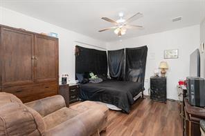 1713 Sycamore Street Commerce, TX 75428 - Photo 13 of 22 a living room with furniture and a flat screen tv