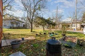 a view of a yard with an outdoor seating