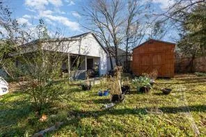 a view of a house with a yard and plants