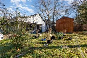 1713 Sycamore Street Commerce, TX 75428 - Photo 22 of 22 a view of a house with a yard and plants