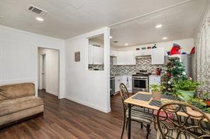 1713 Sycamore Street Commerce, TX 75428 - Photo 4 of 22 a living room with furniture and a fireplace