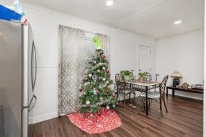 1713 Sycamore Street Commerce, TX 75428 - Photo 8 of 22 a view of a dining room with furniture and wooden floor