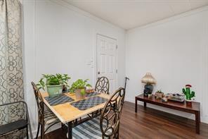 1713 Sycamore Street Commerce, TX 75428 - Photo 9 of 22 a view of a dining room with furniture and wooden floor