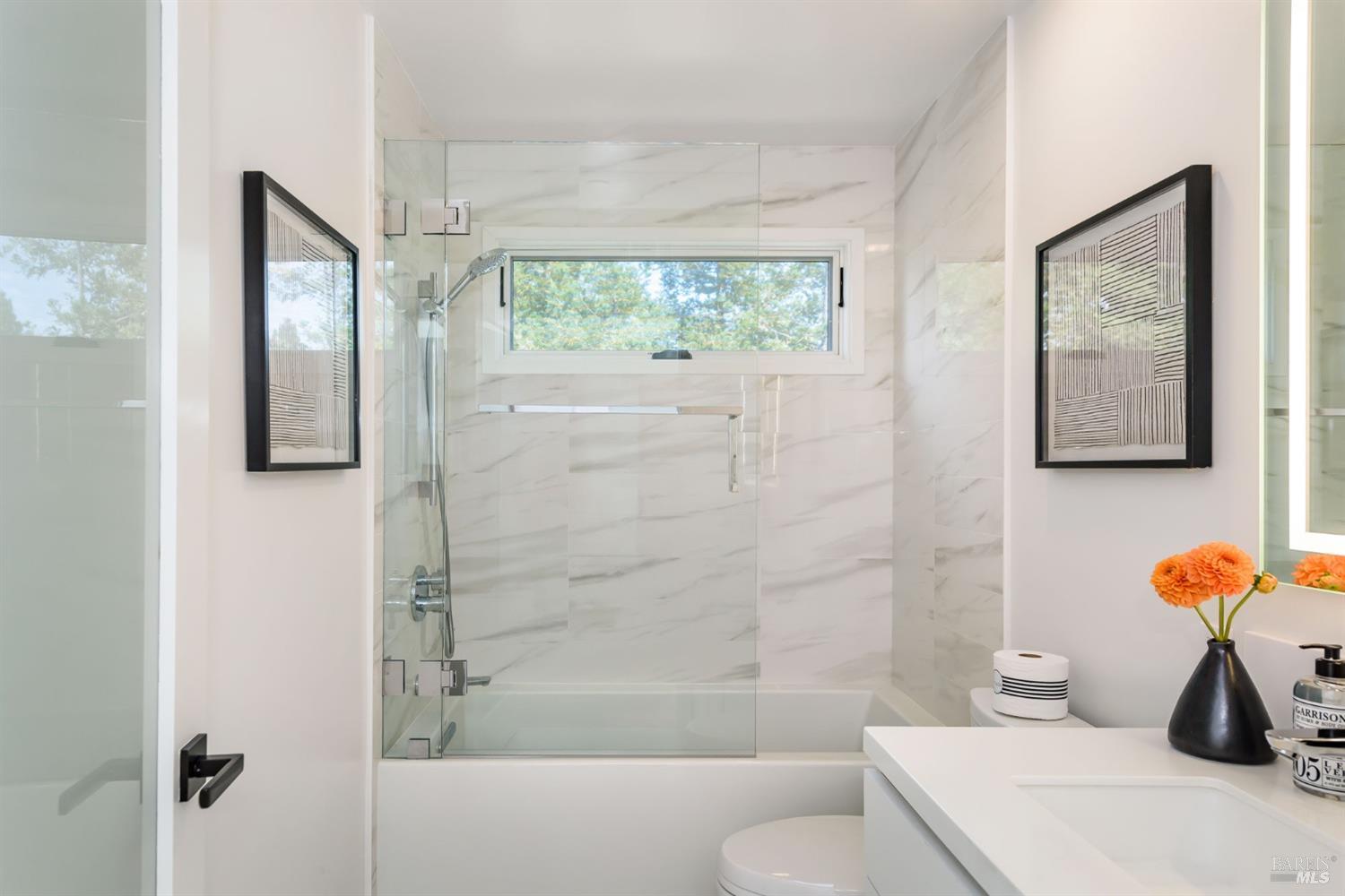 1068 Foster Road Napa, CA 94558 - Photo 17 of 18 a bathroom with a toilet and a shower
