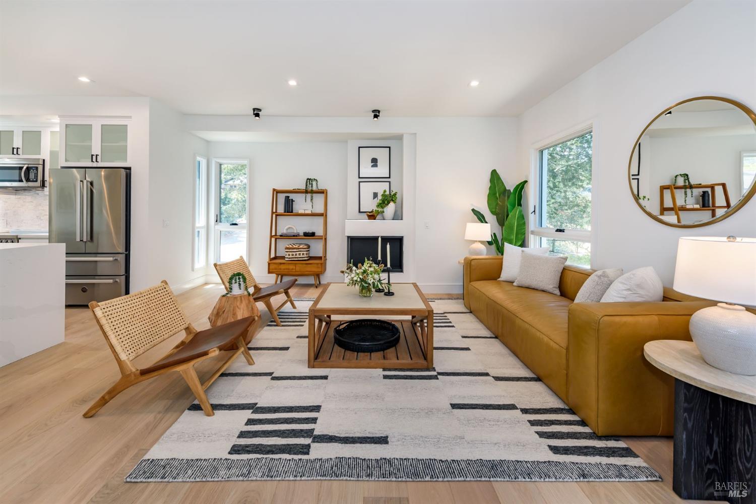 1068 Foster Road Napa, CA 94558 - Photo 3 of 18 a living room with furniture a fireplace and a potted plant