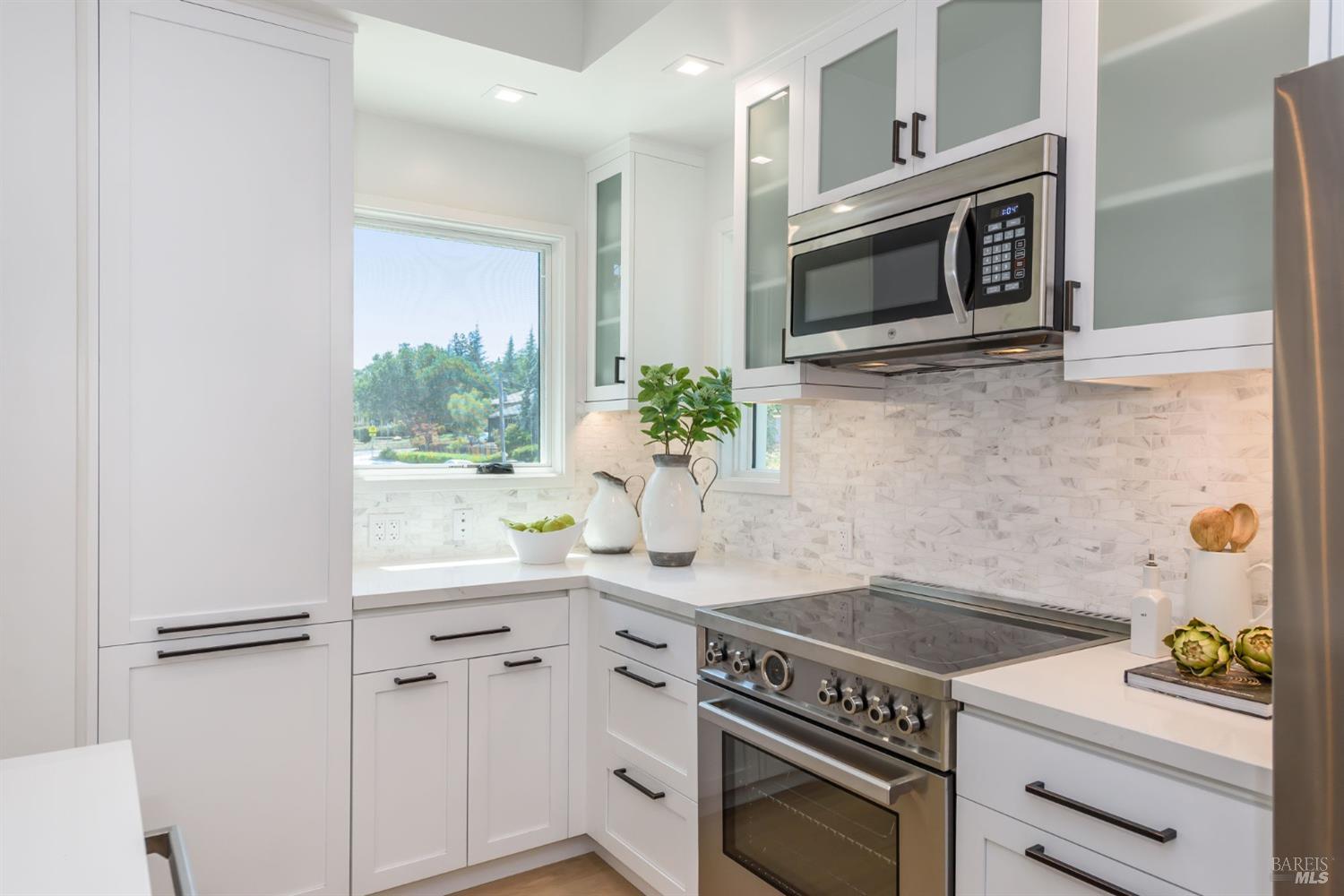 1068 Foster Road Napa, CA 94558 - Photo 7 of 18 a kitchen with a stove and a microwave