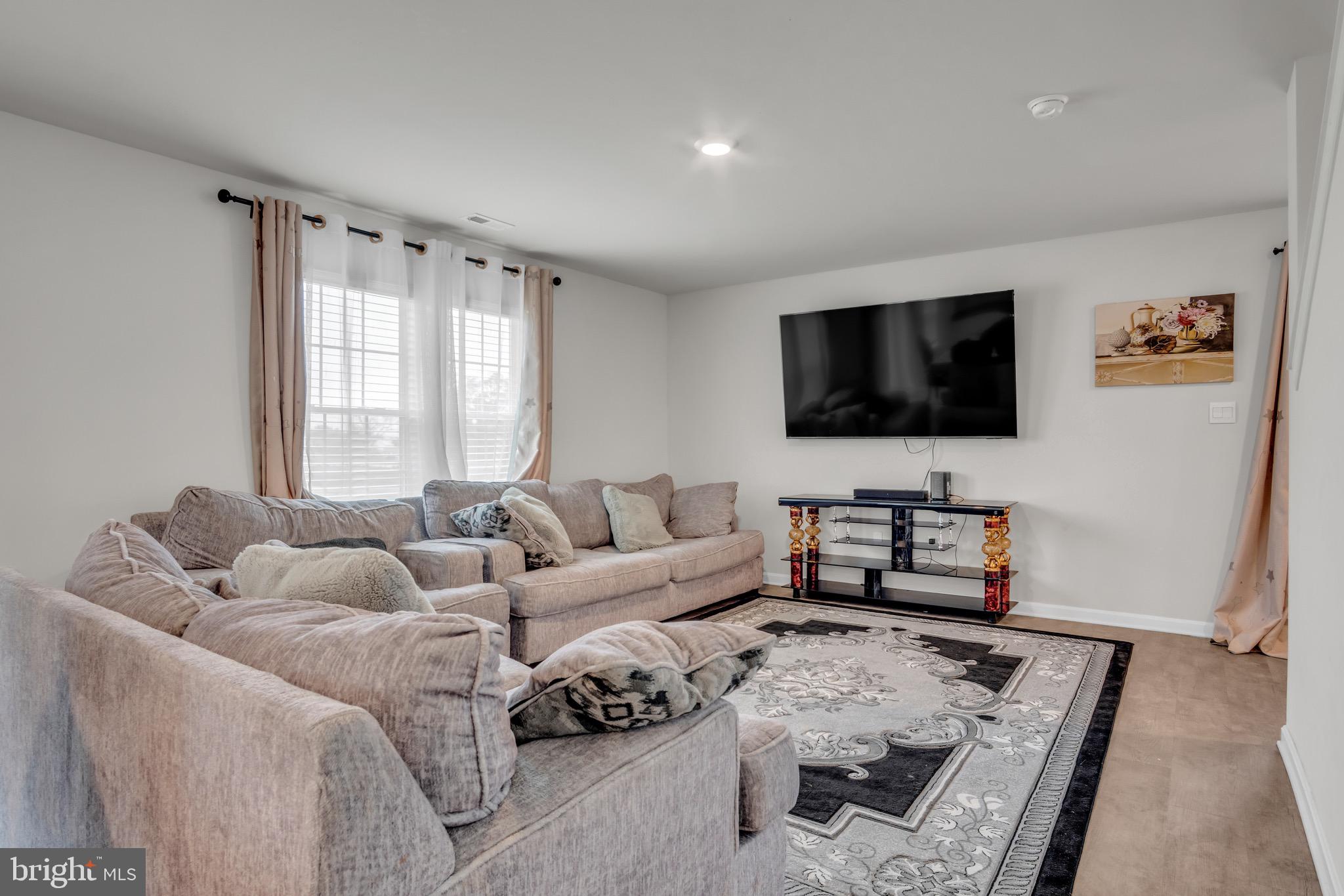 18 Smokehouse Road Carlisle, PA 17013 - Photo 5 of 33 a living room with furniture and a flat screen tv