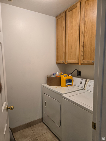 343 300 North, Unit 9 Provo, UT 84601 - Photo 5 of 10 Laundry area featuring cabinet space, separate washer and dryer, and light tile patterned floors