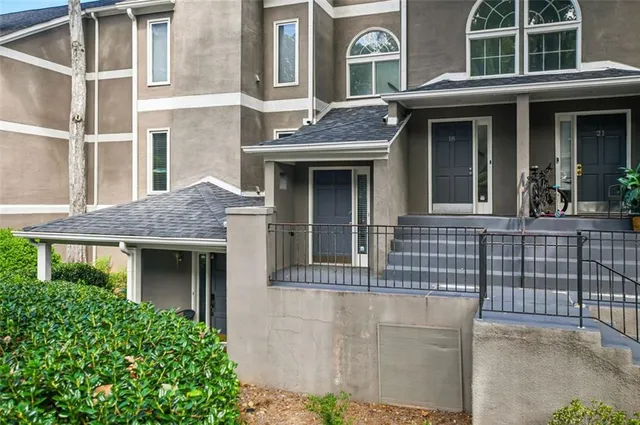 front view of a brick house with large windows