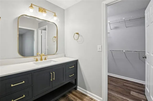 a bathroom with a double vanity sink and a mirror