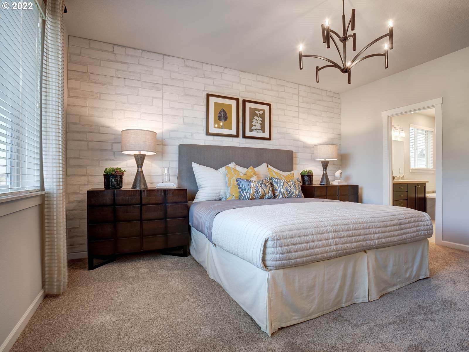 37372 Pink Street, Unit HS 71 Sandy, OR 97055 - Photo 7 of 7 a bedroom with a bed and a chandelier