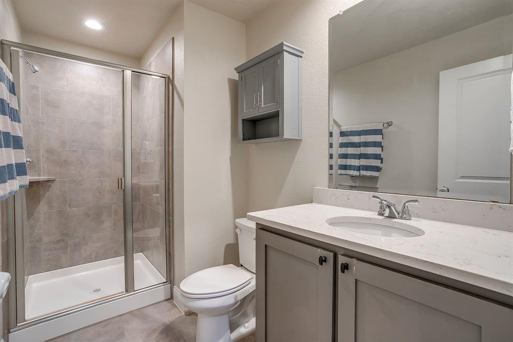 15141 Fleet Hill Road Aledo, TX 76008 - Photo 26 of 37 Bathroom 3 includes single sink vanity and walk in shower.