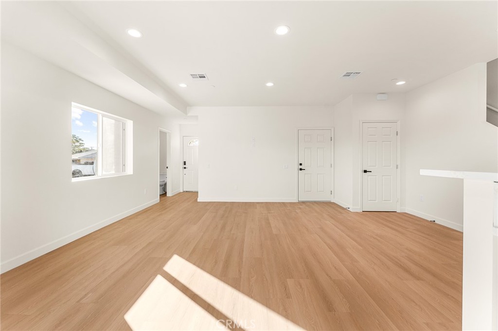 904 South Hert Street Colton, CA 92324 - Photo 13 of 35 a view of empty room with wooden floor and fan