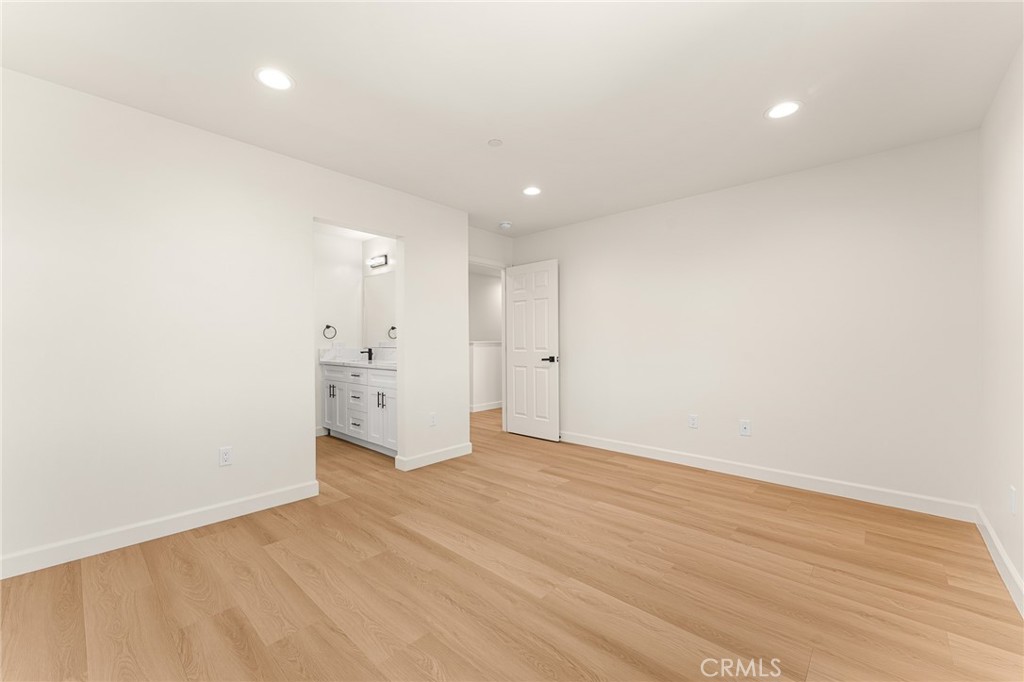 904 South Hert Street Colton, CA 92324 - Photo 24 of 35 an empty room with wooden floor and windows