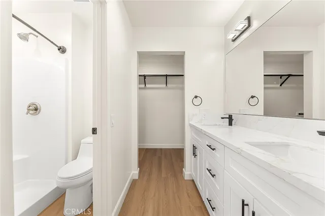 a bathroom with a toilet and shower