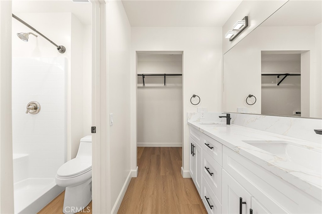 904 South Hert Street Colton, CA 92324 - Photo 25 of 35 a spacious bathroom with a double vanity sink a toilet and a mirror
