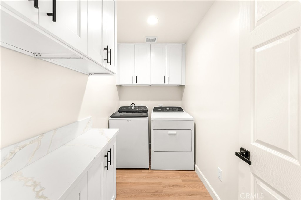 904 South Hert Street Colton, CA 92324 - Photo 28 of 35 a view of storage and utility room with washer and dryer