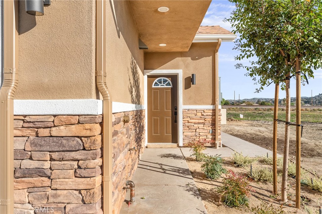 904 South Hert Street Colton, CA 92324 - Photo 6 of 35 a view of a balcony with a floor to ceiling window next to a yard