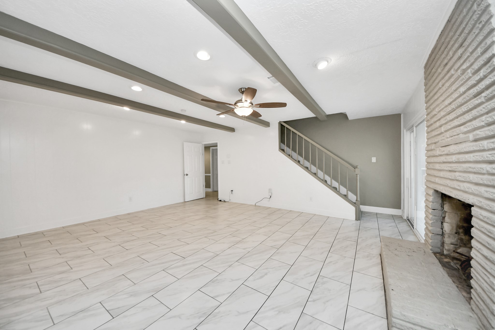 8119 Concho Street Houston, TX 77036 - Photo 11 of 35 This living room is truly massive!