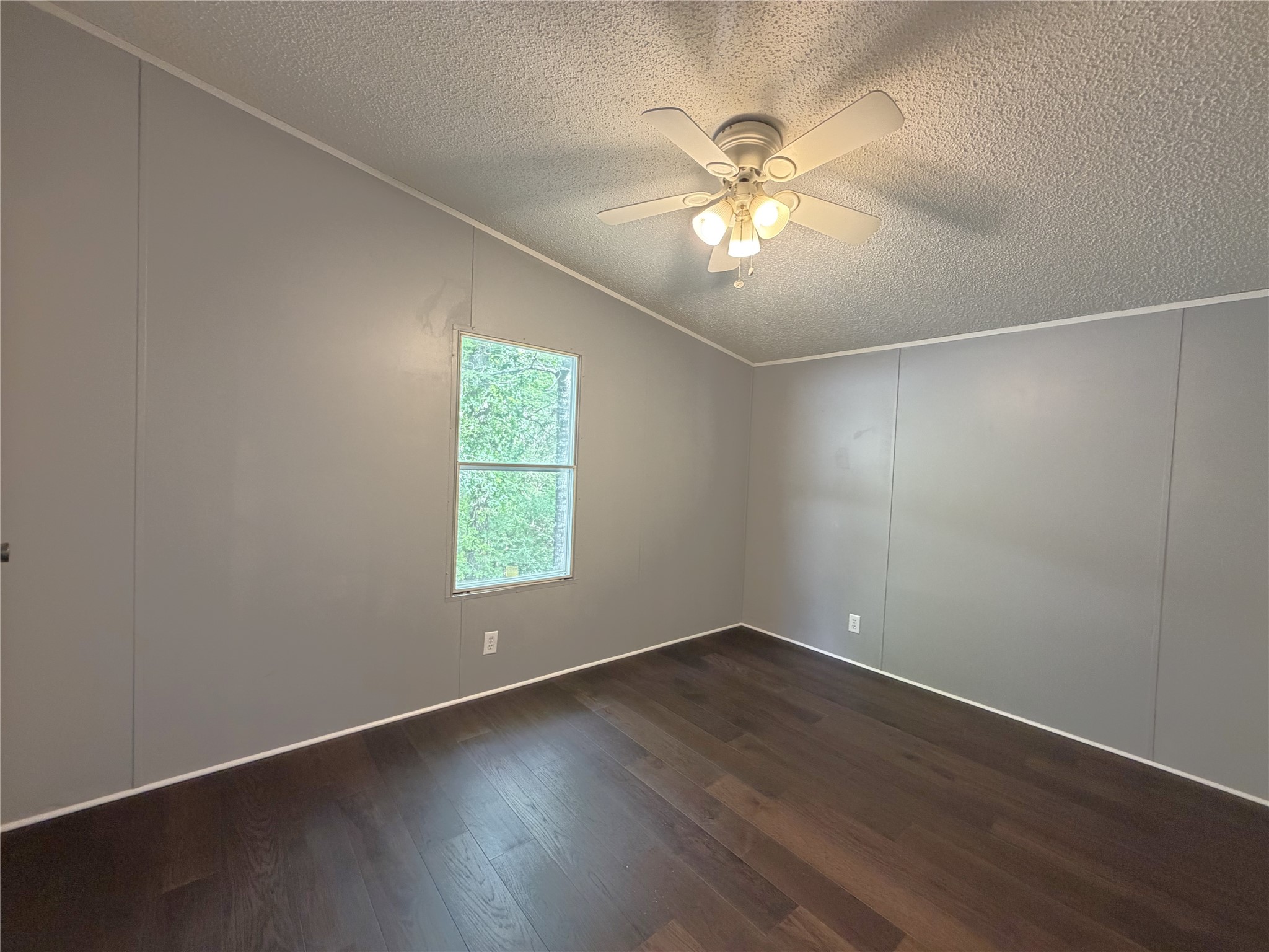 161 Farm To Market 1617 Trinity, TX 75862 - Photo 14 of 15 a view of an empty room with wooden floor and a window