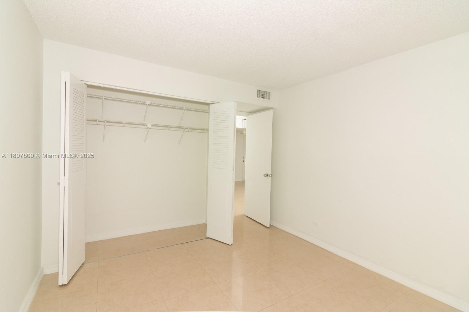 447 Northeast 195th Street, Unit 217 Miami, FL 33179 - Photo 11 of 22 a view of an empty room