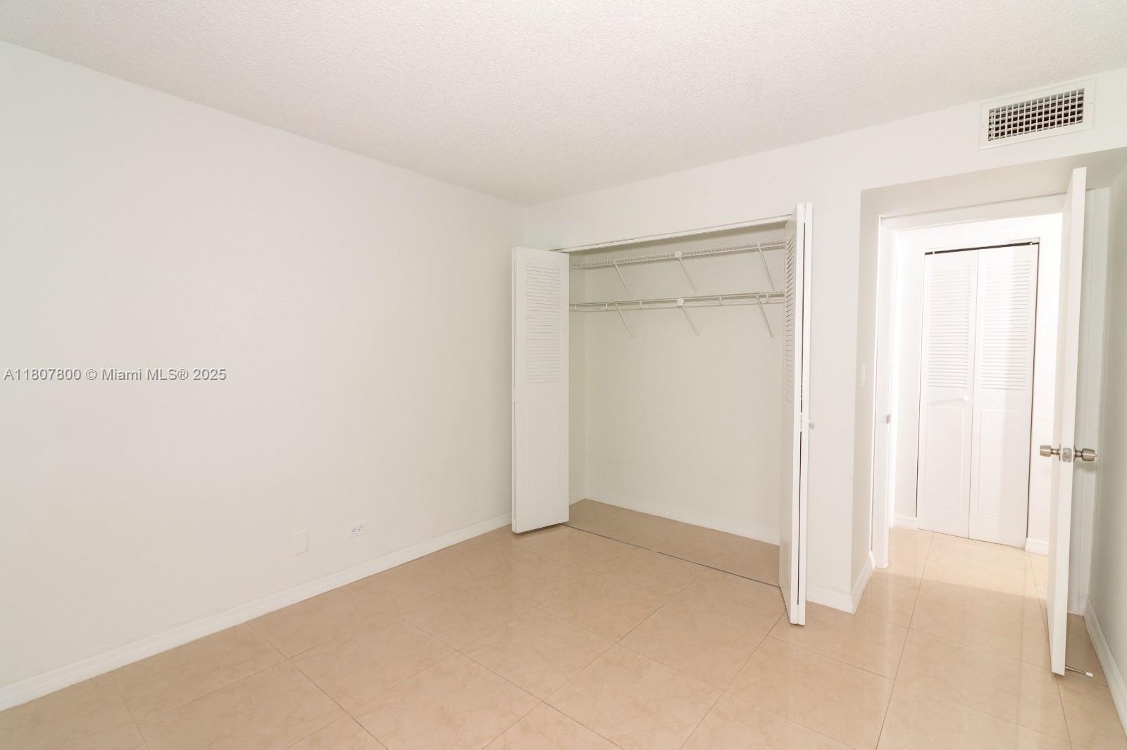 447 Northeast 195th Street, Unit 217 Miami, FL 33179 - Photo 13 of 22 a view of an empty room