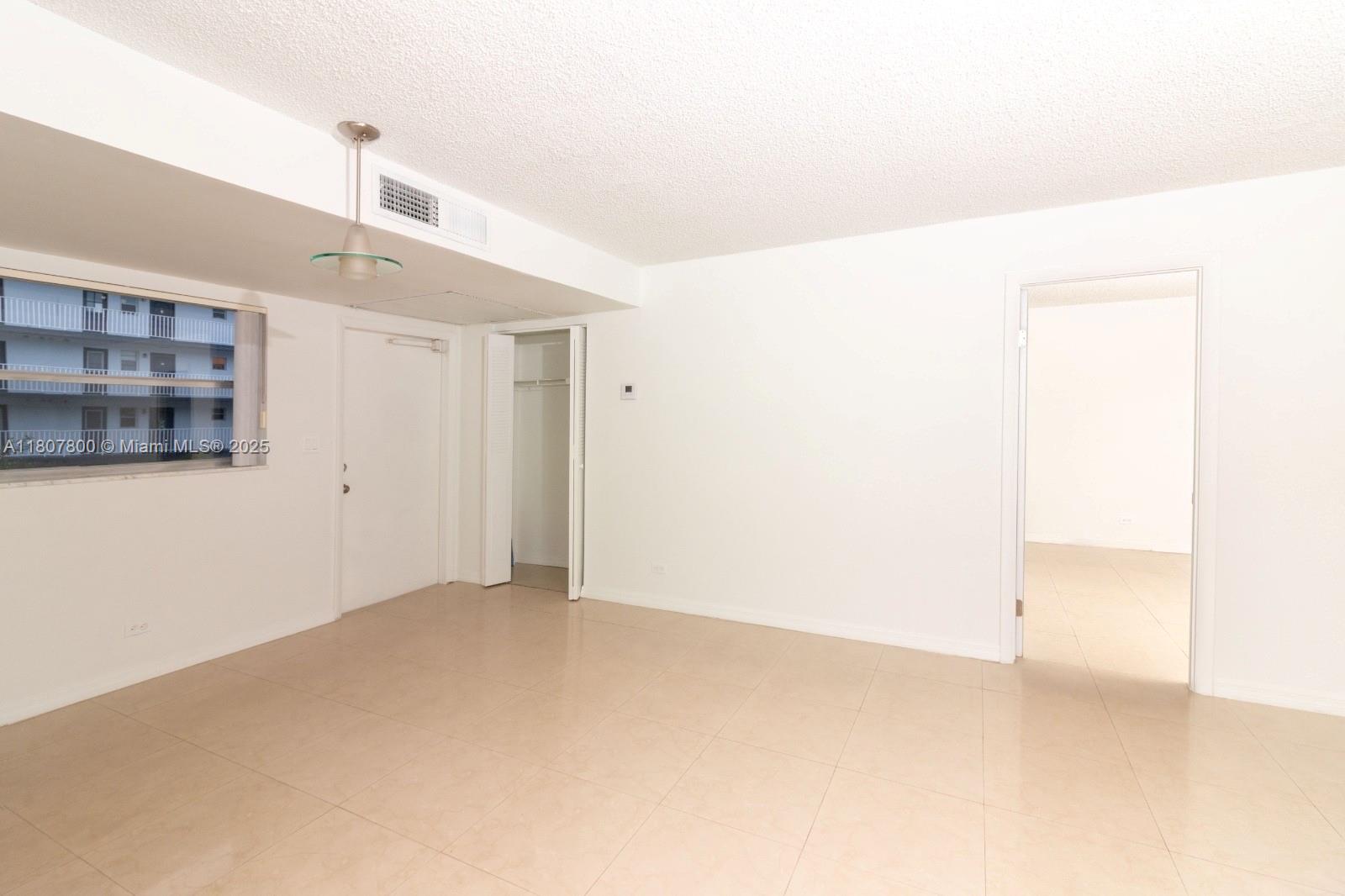 447 Northeast 195th Street, Unit 217 Miami, FL 33179 - Photo 15 of 22 a view of empty room