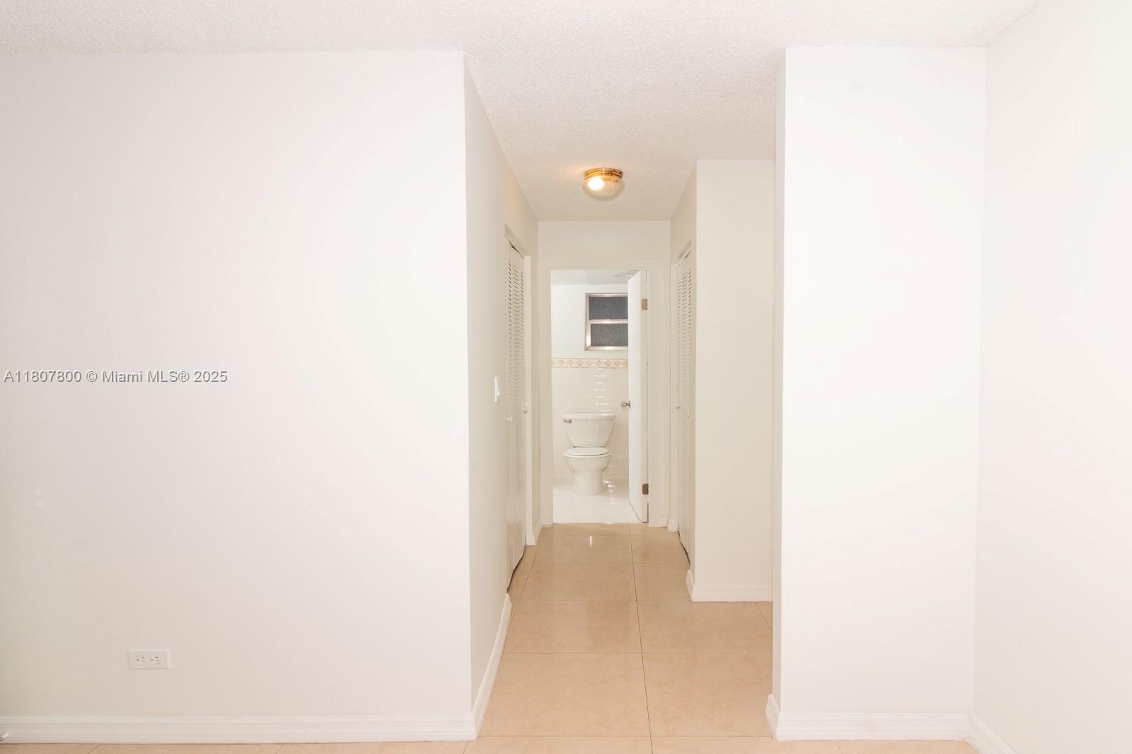 447 Northeast 195th Street, Unit 217 Miami, FL 33179 - Photo 19 of 22 a bathroom with a shower